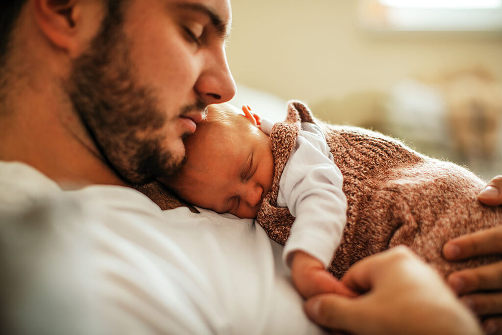 Father cuddling baby